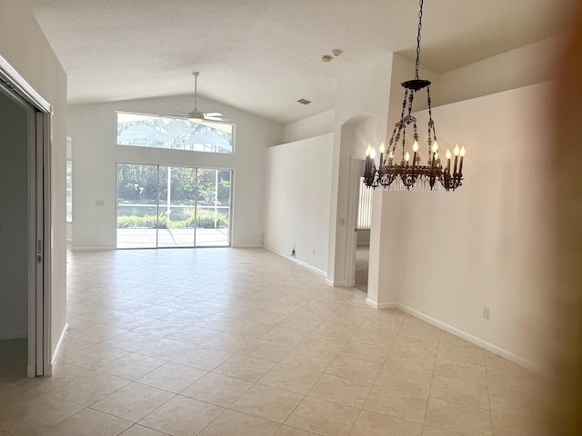 unfurnished dining area featuring light tile patterned flooring, high vaulted ceiling, ceiling fan with notable chandelier, and a textured ceiling