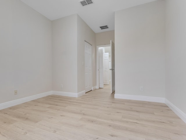 unfurnished room with light wood-type flooring