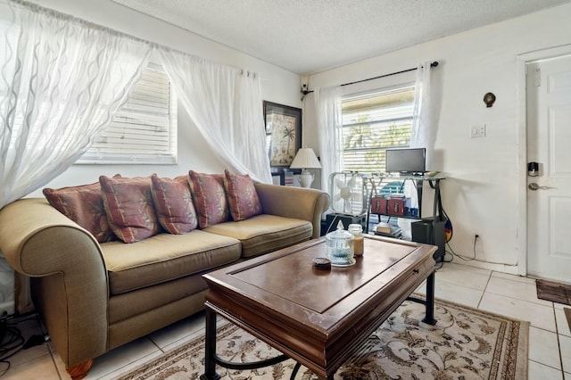 tiled living room with a textured ceiling