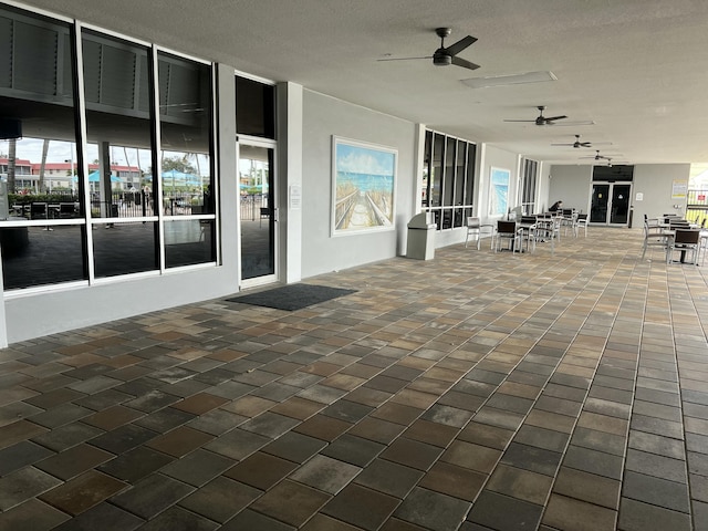 view of patio with ceiling fan