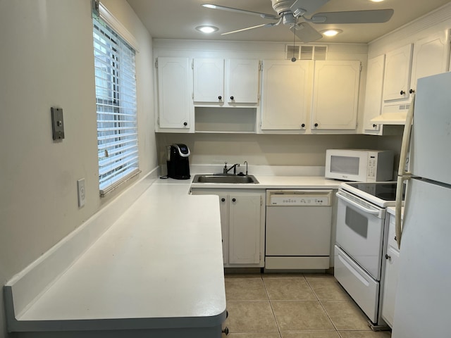 kitchen with sink, white appliances, ceiling fan, white cabinets, and light tile patterned flooring