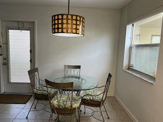 dining area with light tile patterned floors