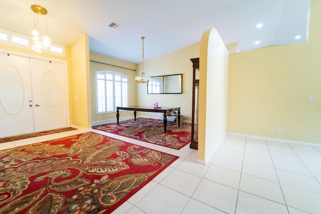 165 Cypress Trce, Royal Palm Beach, FL 33411 - entrance foyer with a chandelier, lofted ceiling, light tile patterned floors, and baseboards