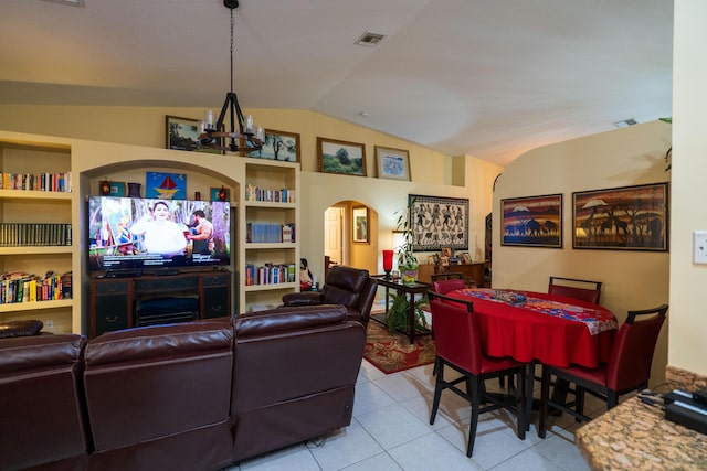 living room featuring lofted ceiling, light tile patterned floors, built in features, and a chandelier