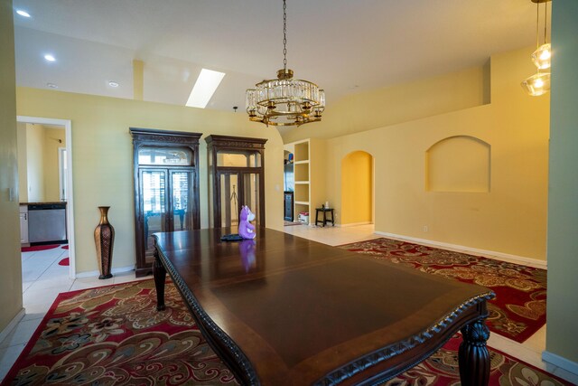 165 Cypress Trce, Royal Palm Beach, FL 33411 - dining room featuring a chandelier, a skylight, baseboards, recessed lighting, and arched walkways