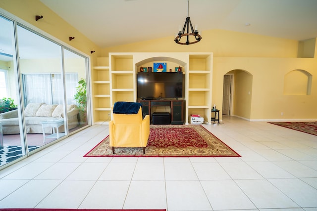 165 Cypress Trce, Royal Palm Beach, FL 33411 - living room featuring vaulted ceiling, arched walkways, built in features, and baseboards