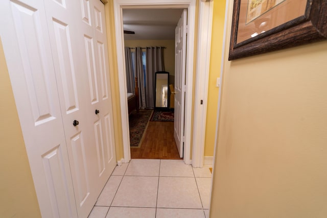 corridor featuring light tile patterned floors