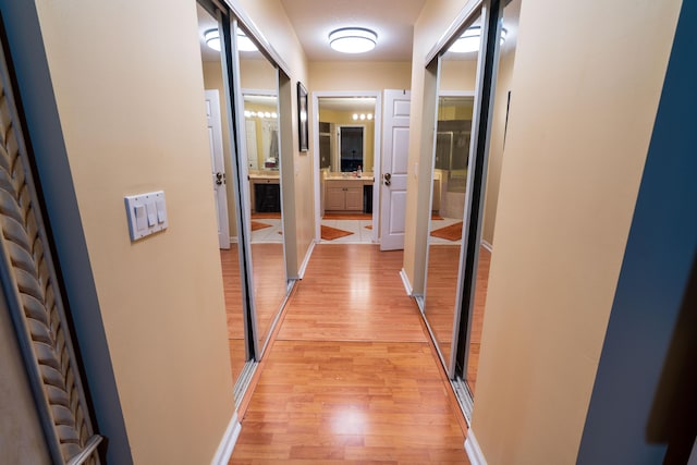 165 Cypress Trce, Royal Palm Beach, FL 33411 - hallway featuring light wood-style flooring and baseboards