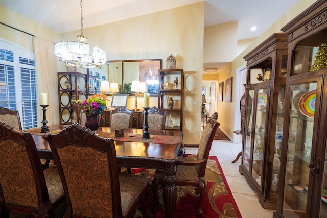 tiled dining area featuring a notable chandelier