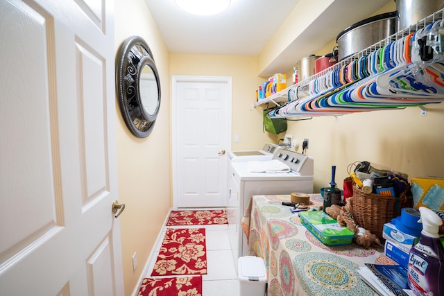 165 Cypress Trce, Royal Palm Beach, FL 33411 - laundry room featuring washing machine and dryer, tile patterned flooring, and baseboards