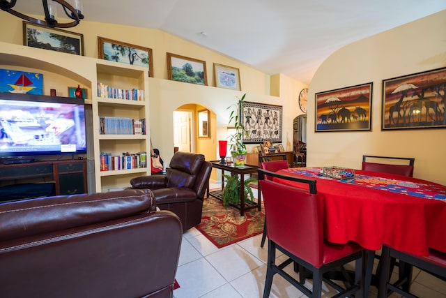 tiled living room with lofted ceiling