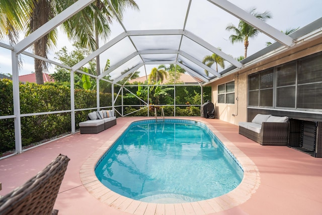 165 Cypress Trce, Royal Palm Beach, FL 33411 - outdoor pool with a patio area, an outdoor living space, and glass enclosure
