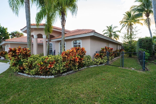 view of home's exterior with a yard