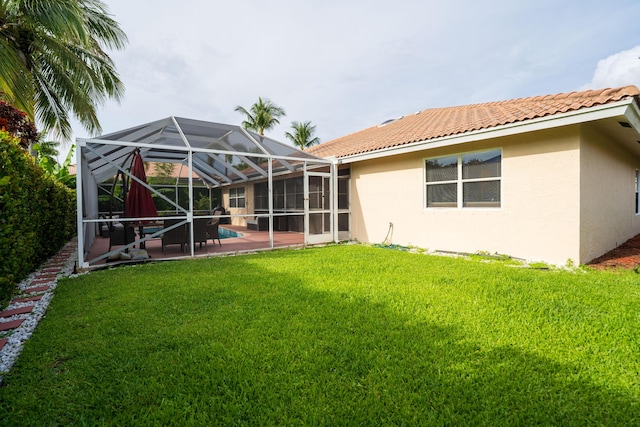 165 Cypress Trce, Royal Palm Beach, FL 33411 - back of property featuring stucco siding, a patio, a yard, a tile roof, and an outdoor pool