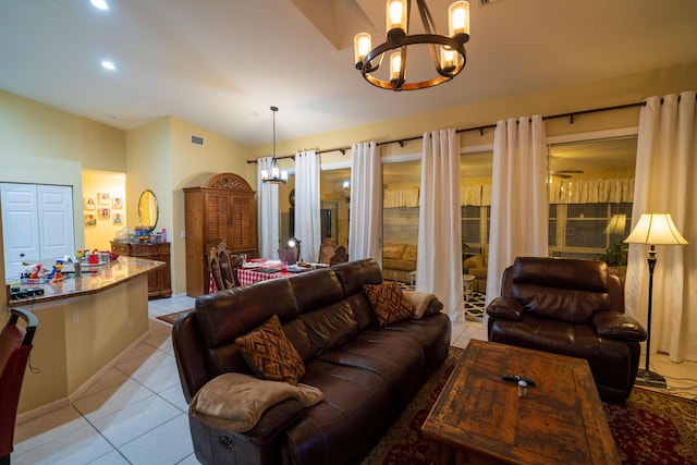 living room with an inviting chandelier and light tile patterned floors