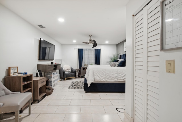 bedroom with light tile patterned floors