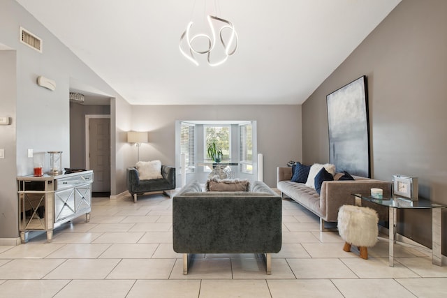 tiled living room with vaulted ceiling and a chandelier