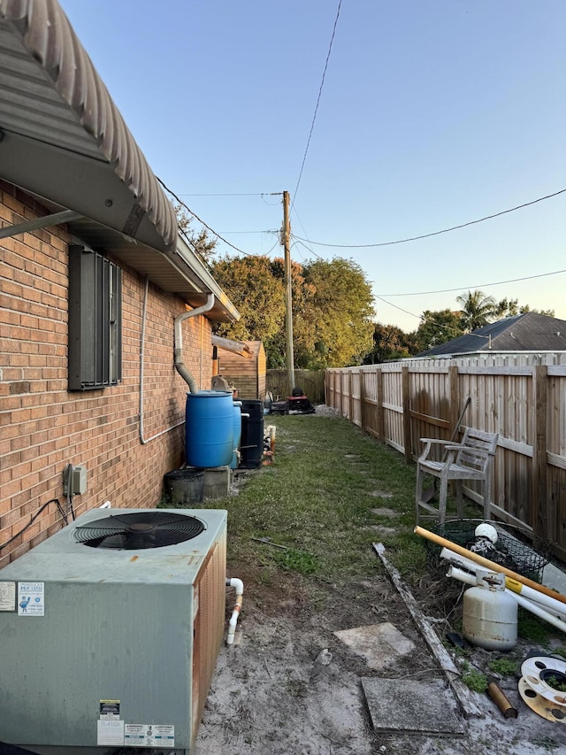 view of yard featuring central air condition unit