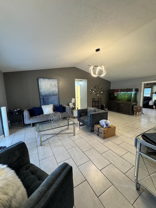 living room with lofted ceiling and a textured ceiling