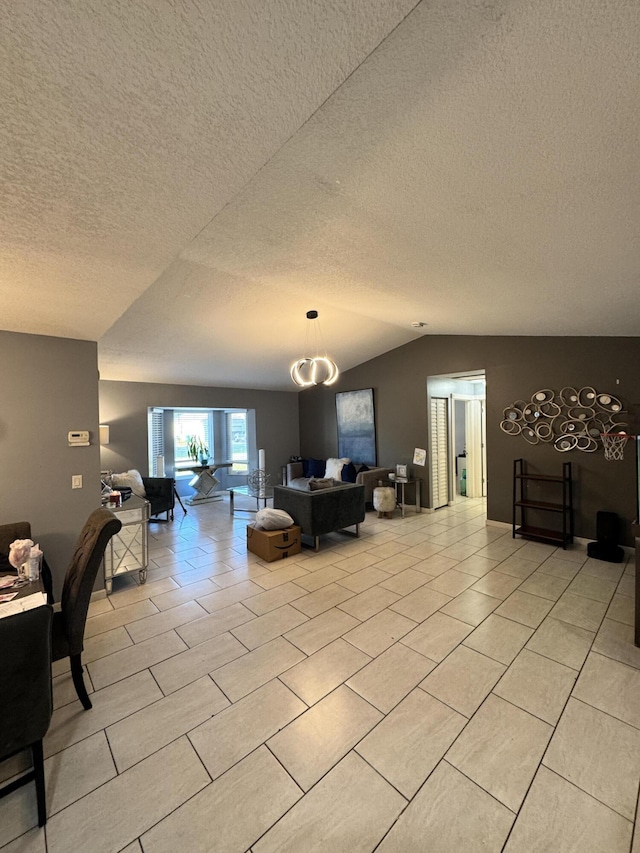 tiled living room featuring vaulted ceiling and a textured ceiling