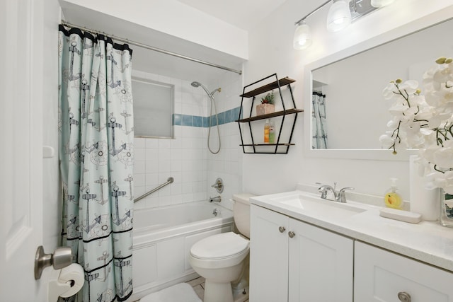 full bathroom with vanity, shower / bath combo, and toilet