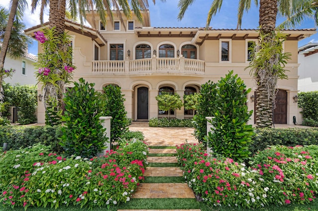 mediterranean / spanish-style home featuring a balcony