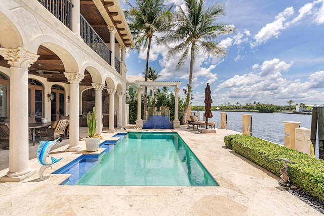 view of pool featuring a water view and a patio