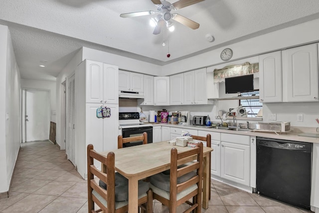kitchen featuring dishwasher, electric range, a sink, under cabinet range hood, and light tile patterned floors