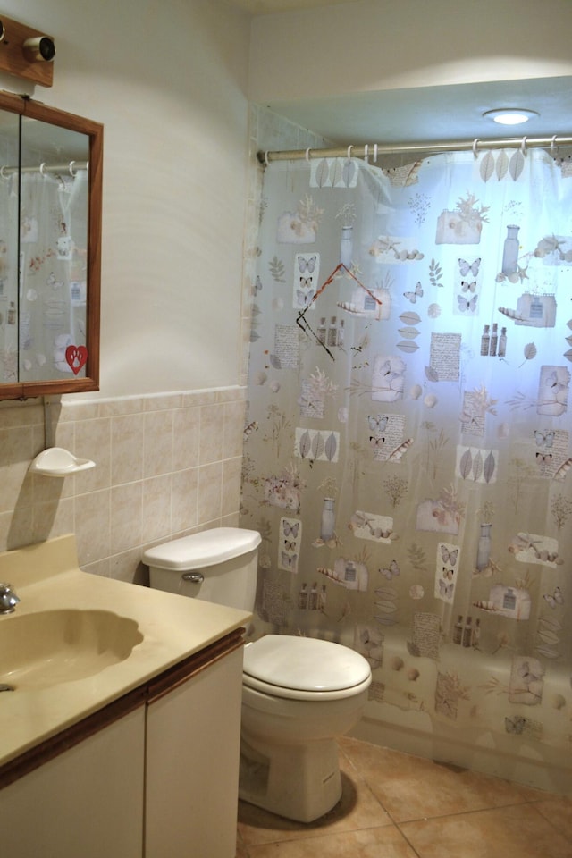 full bath with tile walls, tile patterned flooring, vanity, toilet, and a shower with curtain