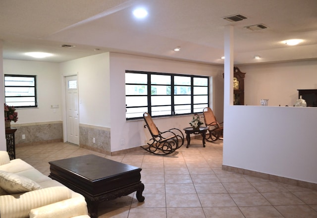 living area featuring light tile patterned floors and recessed lighting