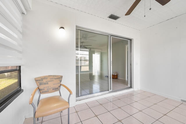 interior space featuring ceiling fan