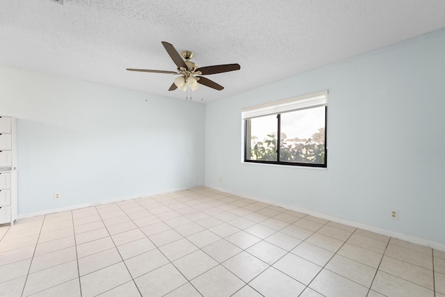 empty room featuring ceiling fan and a textured ceiling