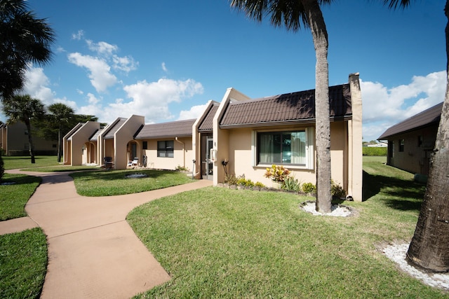 view of front of house with a front yard