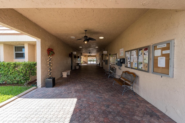 exterior space featuring ceiling fan