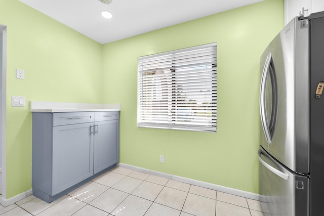 laundry room featuring light tile patterned flooring