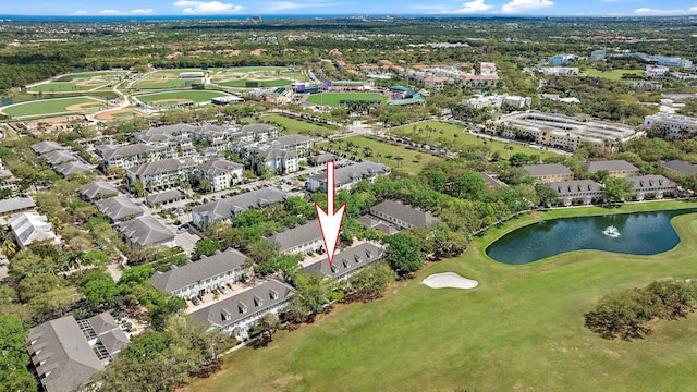 bird's eye view featuring a water view and a residential view