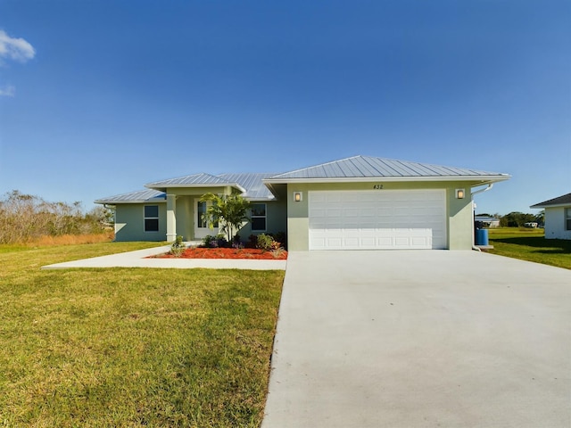 ranch-style house featuring a garage and a front lawn