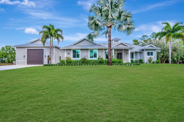 ranch-style home with a garage and a front yard