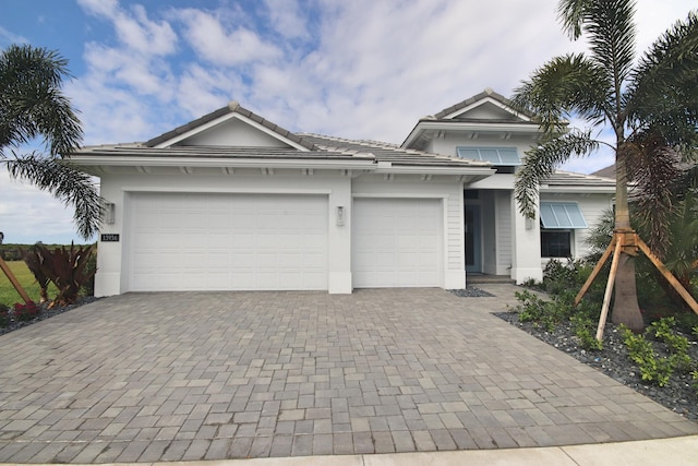 single story home with a garage