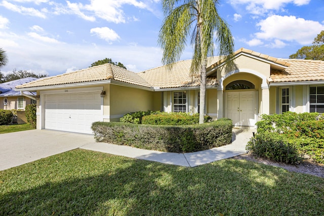 view of front facade with a garage and a front yard