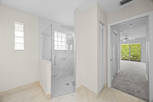 bathroom with a healthy amount of sunlight and an enclosed shower