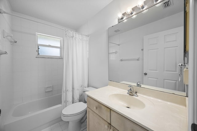 full bathroom with vanity, shower / bath combo with shower curtain, and toilet