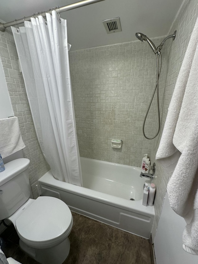 bathroom with shower / tub combo, hardwood / wood-style flooring, and toilet