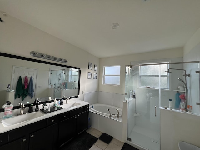 bathroom featuring vanity, tile patterned flooring, and plus walk in shower