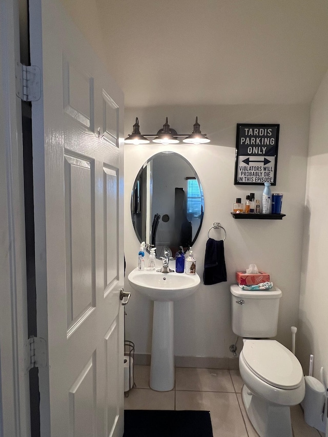 bathroom with tile patterned floors and toilet