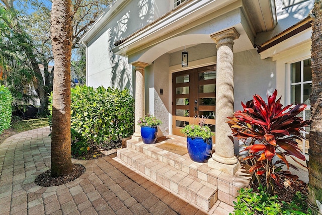 view of exterior entry featuring french doors