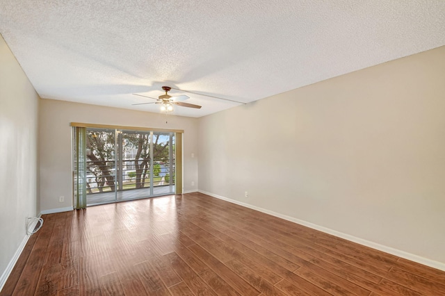 empty room with a textured ceiling, wood-type flooring, and ceiling fan