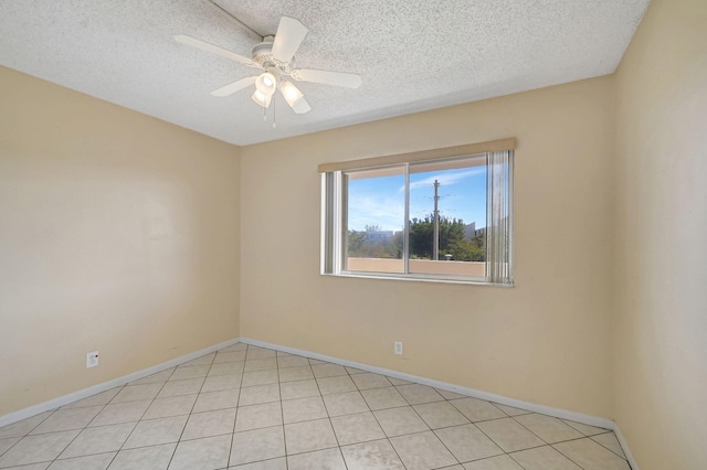 empty room with a textured ceiling and ceiling fan