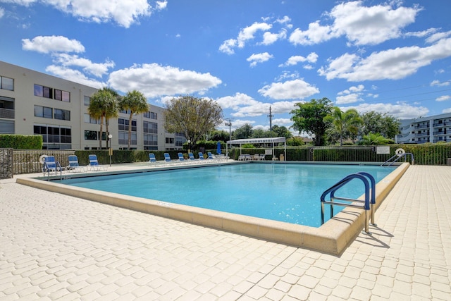 view of swimming pool with a patio area