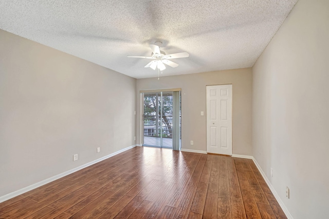 spare room with hardwood / wood-style flooring, a textured ceiling, and ceiling fan